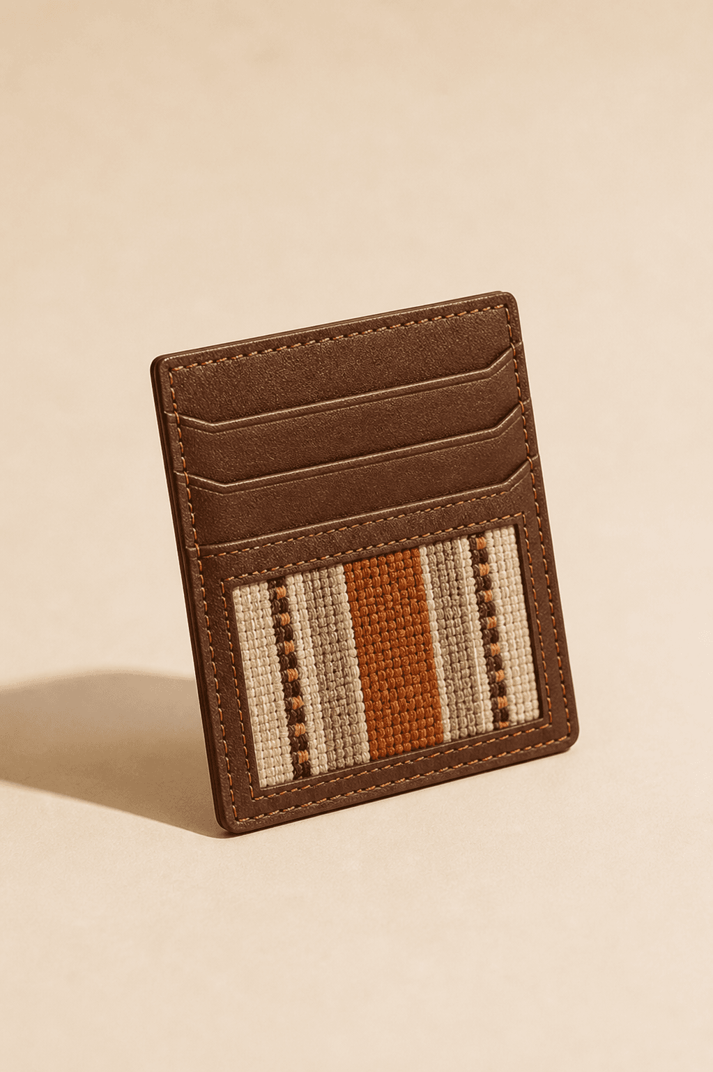 Hazina Wallet compact cardholder with textile detail on cream background