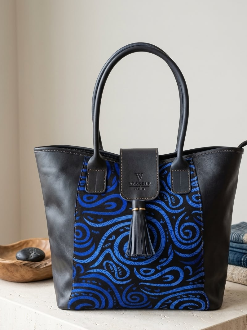 Woman seated with a Vessels tote in a warm editorial setting
